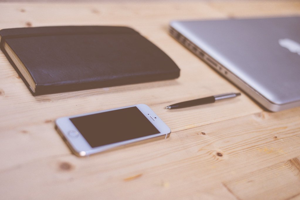Smartphone and desk workspace used for WordPress CTA placement planning